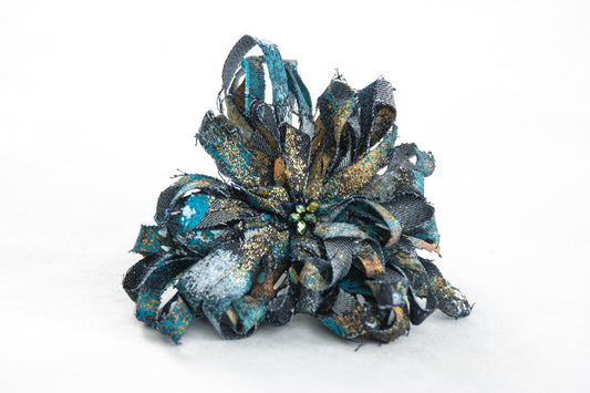 JEANS BROOCH WITH EMBOSSED FLOWER